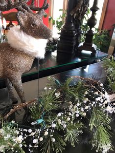 a deer statue is sitting on a table