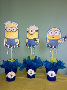 three minion centerpieces on top of a table