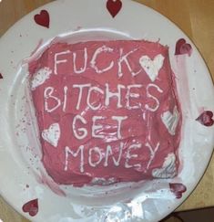 a cake that has been decorated with words and hearts on the side, sitting on a plate