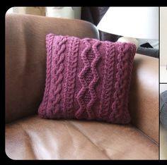 a pink knitted pillow sitting on top of a brown couch