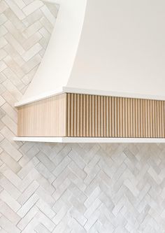 a stove top oven sitting inside of a kitchen next to a white tiled countertop