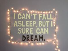 a sign that says i can't fall asleep but sure can dream on it