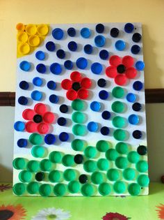 an art project made out of plastic cups and buttons