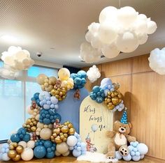 balloons and decorations decorate the entrance to a baby's first birthday