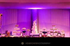 a table topped with lots of cakes and desserts