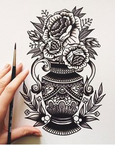 a drawing of a vase with flowers and leaves on it, next to a pencil