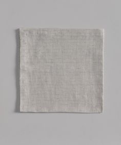 a white cloth on a gray background