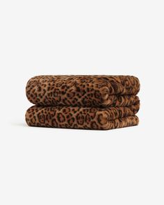 three leopard print towels stacked on top of each other