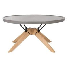 a round table with wooden legs and a concrete top