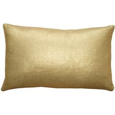 a gold pillow on a white background