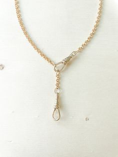 The Iris necklace with extender is a 14k gold filled Belcher Rolo chain with one swivel clasp and an attached extender. The link is approximately 3.5mm wide.  It is a substantial weight without being heavy, and very durable. Th extender is approximately 1.8 inches long. The swivel is brass with a thick layer of 14k gold. To purchase this necklace without the extender, please go here https://www.etsy.com/listing/1675602626/the-iris-necklace-with-swivel-clasp-14k . What is gold filled?  Gold fille Round Charm Necklace With Adjustable Chain, Gold Timeless Lariat Necklace For Formal Occasions, Timeless Gold Lariat Necklace For Formal Occasions, Timeless Gold Lariat Necklace For Formal Events, Timeless Yellow Gold Necklace With Lobster Clasp, Timeless Formal Chain Necklace With Lobster Clasp, Timeless Gold Lariat Necklace, Timeless Yellow Gold Toggle Necklace With Adjustable Chain, Classic 14k Gold Lariat Necklace