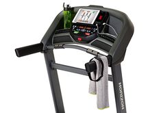 an exercise machine with a bottle and towel on it