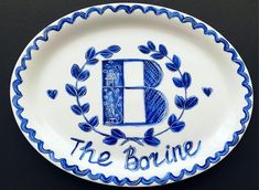 a blue and white plate with the letter b on it that says, the brine