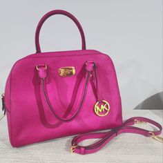 Vintage Michael Kors Fuchsia Pink Hand And Shoulder Bag Like New Clean Inside And Out. Condition..10" H 14" Wide.. ..5 Inside Pockets... 1 Outside Pocket..Shoulder Strap Inside Never Used.. Michael Kors Pink Shoulder Bag With Detachable Handle, Pink Michael Kors Shoulder Bag With Detachable Handle, Michael Kors Pink Top Handle Satchel, Michael Kors Pink Double Handle Satchel, Pink Michael Kors Double Handle Satchel, Michael Kors Pink Satchel For Everyday Use, Chic Pink Michael Kors Satchel, Pink Michael Kors Shoulder Bag With Handles, Michael Kors Pink Bag With Gold-tone Hardware