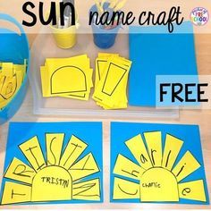 the sun is made out of yellow paper and sits on a table next to other items