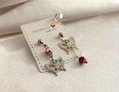 Hua Cheng inspired butterfly mismatched earrings with cuff for tgcf funs. Materials: stainless steel, glass. Stud closure+ silicone backstoppers. Earring length 4,5 cm. Chain length (to cuff) 5 cm. Also length could be different if you want so - just write it to me in messages. Packed in gift box 👌 More Chineese bl novel inspired jewelry watch here https://biserannna.etsy.com?section_id=41709546 Hua Cheng, Jewelry Watch, Mismatched Earrings, Inspired Jewelry, Butterfly Earrings, Chain Length, Jewelry Earrings Dangle, Ukraine, Jewelry Watches