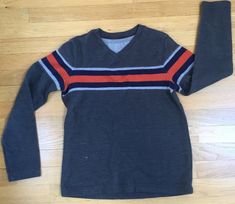 You are bidding on ONEUrban Pipeline,  Boys 'sweater' top size Large There is an orange, blue and grey strip across the front and around the sleeves The back is plain grey. Quite thick material almost like a 'sweater' Gently worn I offer combined shipping rates  Please ask any questions before bidding:) thanks for looking! Casual Long Sleeve Striped Sweater, Cotton Sweater With Horizontal Stripes For Winter, Winter Cotton Sweater With Horizontal Stripes, Fall Long Sleeve Sweatshirt With Contrast Stripes, Winter Horizontal Stripe Cotton Sweater, Casual Long Sleeve Sweater With Striped Sleeves, Fall Sweatshirt With Striped Sleeves, Striped Long Sleeve Sweatshirt For Winter, Winter Sweater With Striped Long Sleeves