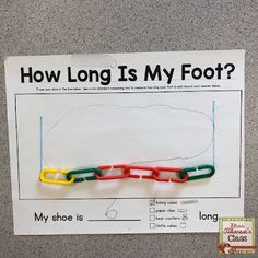 a paper clip with the words how long is my foot? on it next to a poster