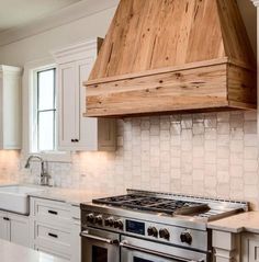 a stove top oven sitting inside of a kitchen