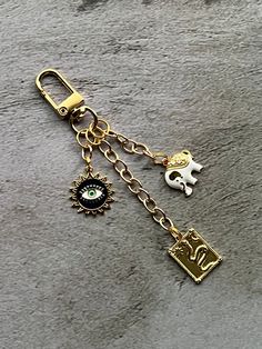 This purse charm is made with unique charms with a gold tone.  This purse chain charm would fancy up any purse. This purse charm would make a gift for someone special. This charm is almost 4.5  inches long.  This listing is for the chain with charms only.  Bag, books and photo props are not included.  Please feel free to message me with any questions or custom orders Chain With Charms, Elephant Charm, Make A Gift, Purse Charms, Bags Purses, Unique Charms, Lanyard, Photo Props, Custom Orders