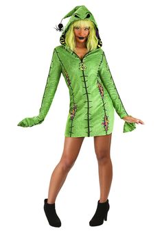 a woman in a green costume posing for the camera