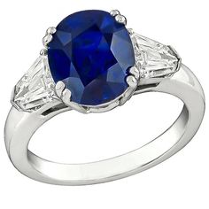 This amazing platinum engagement ring is centered with a royal blue GRS certified oval cut sapphire that weighs 4.04ct. The center stone is flanked by sparkling shield cut diamonds that weigh approximately 0.80ct. graded G color with VS1 clarity. The ring is size 6 1/4, and can be resized. Inventory #30102BRSS Antique Engagement Rings Sapphire, Sapphire Engagement Rings, Diamond Sapphire Engagement Ring, Platinum Engagement Ring, Platinum Diamond Engagement Rings, Platinum Diamond Rings, Gem Diamonds, Rings Engagement, Platinum Engagement Rings