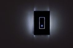 a black light switch in a dark room with no one on it's side