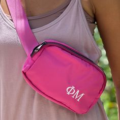 A sorority personalized belt bag is a must-have accessory for any college student! This stylish bag is the perfect size to carry all of your essentials while keeping your hands free. Made from high-quality nylon fabric, this bag is both durable and fashionable. It's the perfect gift for bid day, new initiates, or big/little sis! • 8" x 5" nylon with lined nylon interior. • Top zipper and back zipper pocket• One mesh pocket front interior and divided mesh pocket on back interior• Personalized with embroidery thread monogram • Adjustable 1.5" wide strap is 40" when fully extended• Spot clean.The bags for each sorority are in the following colors:Alpha Chi Omega: Red bag/black threadAlpha Delta Pi: Royal bag/light blue threadAlpha Omicron Pi: Gray bag/red threadAlpha Phi: Gray bag/red wine th Hot Pink Bag, Sorority Big Little, Big Little Gifts, Alpha Chi Omega, Phi Mu, Beige Bag, Alpha Chi, Grey Bag, Sorority Gifts