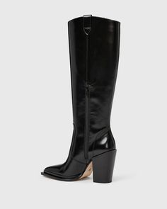 This show-shopping high heel tall boot is one of our favorites of the season. Pacey is crafted from luxuriously soft black leather with a curved topline that dips at the front and back for a flattering look, an extended smooth leather step welt with an exaggerated wall surrounding the toe, and a black stacked underslung block heel. This pair features western yoke pattern details at the topline on both sides and the half tonal inside zipper allows for easy on and off. | Pacey Boot - Black Leather Yoke Pattern, Black Boots Tall, Tall Boot, Black Leather Boots, Tall Boots, Soft Black, Smooth Leather, Black Boots, High Heel