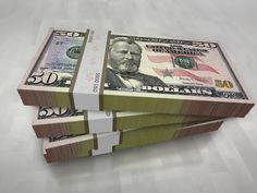 three stacks of money sitting on top of each other