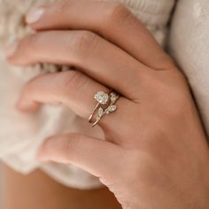 a woman's hand with a ring on it