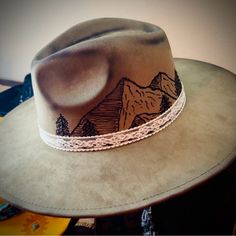 This Olive Suede Fedora Is Stunning Smoothe, Beautiful Texture! Simple Mountains And Trees With A Thin Lace Band! Perfect Accessory For Any Fall/Winter Outfit! Mountains And Trees, Flat Brim Hat, Lace Bands, Hat Ideas, Mountain Scene, Felt Hat, Beautiful Textures, Brim Hat, Custom Hats