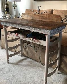 a coffee table with drawers underneath it in a living room next to a couch and lamp