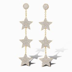 Limited Edition These dazzling Stars for Wendy statement earrings are a limited edition piece designed to turn heads. Featuring three glittering star drops encrusted with pavé cubic zirconia, these earrings bring a bold sparkle to any look. Perfect for transitioning seamlessly from day to night, they add an eye-catching and glamorous touch to elevate any outfit. Details Lightweight statement earrings Made of pavé cubic zirconia stone Skillfully handcrafted in 14k gold over recycled brass Our gol Hanging Gold Earrings, Jaipur India, Big Star, Happy Fall, Star Earrings, Pave Diamonds, Free Giveaway, Jaipur, Shop Earrings