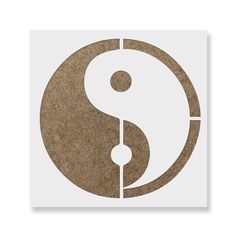 a white and brown yin symbol on top of a piece of paper with the letter s in it