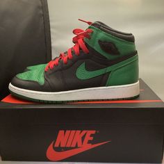 Elevate your sneaker game with these Nike Air Jordan 1 Retro High OG Pine Green 2.0 GS 2020 sneakers. The limited edition sneakers feature a high top shoe shaft style and a stylish colorblock pattern in a beautiful green colorway. The shoes are made of premium leather and have a standard shoe width, making them comfortable for all-day wear. These sneakers are perfect for teens and adults who love athletic shoes with a retro theme. They are suitable for various activities, including school, lifestyle, skateboarding, and basketball. The Air Jordan 1 Retro High OG Pine Green 2.0 GS 2020 sneakers are a must-have for fans of the iconic Air Jordan brand and Michael Jordan. “Like New”. In Great Condition The Sneakers show signs of minor ware +++++ORIGINAL BOX INCLUDES +++++ Green Basketball Shoes With Boost Midsole For Streetwear, Green Basketball Shoes With Rubber Sole For Streetwear, Green Basketball Shoes For Streetwear, Sporty Green Basketball Shoes For Streetwear, Green Sporty Basketball Shoes For Streetwear, Green Jordan Shoes With Rubber Sole For Sports, Green Skate Shoes With Boost Midsole For Streetwear, Casual Green Basketball Shoes For Streetwear, Green High-top Basketball Shoes For Streetwear