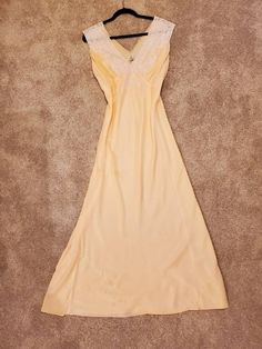 "1930s Trillium Silk Underthings Nightgown/Hostess/Slip/Dress, 100% Silk, Bodice Trimmed with Alencon French Lace,Peach,Size 19,XL, Ties at the back are intact. There are a few very tiny pin holes in the fabric and a few tiny light brown stains (see pictures for flaws), but overall this dress is in great vintage condition for being 90 years old. I hand washed this with Woolite and ironed it. It is a beautiful piece of historic clothing. Ultra feminine with the lace at the bodice. Bias cut silk. Womens Lingerie, Historic Clothing, Ultra Feminine, Black Lace Tops, French Lace, Historical Clothing, Dress 100, Halter Formal Dress, Women Lingerie