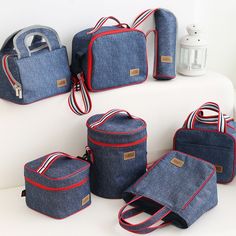 six pieces of denim bags with red and white stripes on the handles, shoulder straps, and bottom zippers