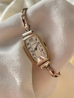 Very Rare Vintage 1930s Swiss Art Deco Rolled Rose Gold Wind Up 15 Jewels Rectangular Dial Ladies Cocktail Dress Wristwatch By Elkington  This is a very beautiful item in remarkable condition considering it's vintage age. Appears to have been very well looked after and stored over the years.   The face is cream and has a wavey ribbed effect,  it is very clean and scratch free (some light age related patina on the dial which adds character and charm) The dial features classy black printed art dec Ray Rectangle Cocktail Watch, Swiss Art, Watch Drawing, 1930 Art, Printed Art, Womens Cocktail Dresses, Metallic Blue, Women Wrist Watch, Black Print