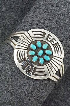 This stunning bright-polish sterling silver bracelet was made by Navajo silversmith Rosco Scott. The inside of the cuff is signed Rosco Scott and stamped sterling.Size: 5 3/4" (will fit up to a 6 3/4" wrist)Gap: 1"Width: 1 7/8"Cuff Width: 1/2"Free shipping on all orders! We ship with USPS and always include tracking. All orders ship within a day of payment.Returns are accepted up to 30 days after you receive your order. Just send us a message. Our shop offers cash back or store credit. The item must be returned in new condition. Turquoise Sterling Silver Cuff Bracelet With Inlay, Sterling Silver Southwestern Round Cuff Bracelet, Sterling Silver Turquoise Cuff Bracelet With Inlay, Southwestern Sterling Silver Round Cuff Bracelet, Southwestern Stamped 925 Cuff Bangle Bracelet, Unique Sterling Silver Cuff Bracelet With Inlay, Southwestern Style Stamped 925 Bangle, Southwestern Silver Cuff Bracelet With Inlay, Bear Carving