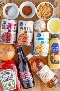 the ingredients to make an apple cider are laid out on a wooden table