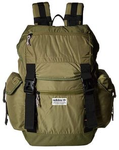 a green backpack with black straps on the front and side pockets that are attached to it