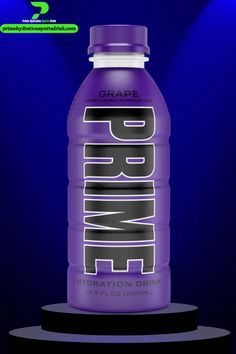 a bottle of grape water sitting on top of a black stand with blue lights behind it