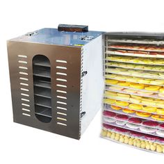 an image of a food dehydrator with trays full of different foods