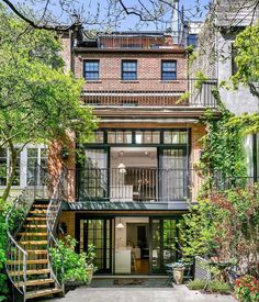 an apartment building with stairs leading up to it