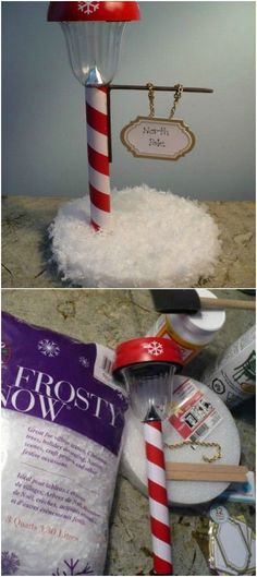 there is a red and white candy cane on top of the snow covered table cloth