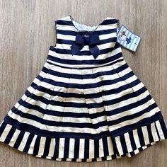 Nwt Chebelle Striped Dress Is Adorable! Navy And White Stripe Dress With Grosgrain Bow And Trim, Box Pleats On The Skirt, And A Tie Back. Perfect Condition Never Worn Smoke Free Home Cute Navy Sleeveless Dress, Cute Sleeveless Navy Dress, Cute Navy Dress For Dress-up Occasions, Navy Cotton Playtime Dress, Navy Cotton Dress For Playtime, Holiday Formal Dresses, Vintage Prairie Dress, Lace Ruffle Dress, Blue Cable Knit Sweater