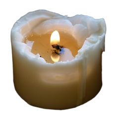 a lit candle with white wax in it