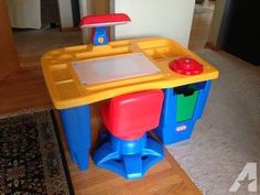 a child's play table with a laptop on top