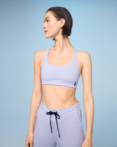 Made for low-impact workouts, flow into every movement with this buttery-soft, lightly padded sports bra. Made with moisture-wicking materials and a strappy open back for increased ventilation. The power mesh liner also keeps sweat out, so you can focus on your movement. Move freely, thanks to the open back design and gentle elastic underband. So you can bend and breathe in any direction. It's so lightweight, it's off your mind. Ultra-soft cups and soft, supple fabrics create a bra you'll want t Breathable Compressive Sports Bra, Compressive Versatile Sports Bra, Compressive Sports Bra With Moisture-wicking And Wide Straps, Compressive V-neck Activewear With Built-in Bra, Yoga Sports Bra With Built-in Padding And Mesh Material, Womens Movement, Sports Bra Design, Working Out Outfits, Padded Sports Bra